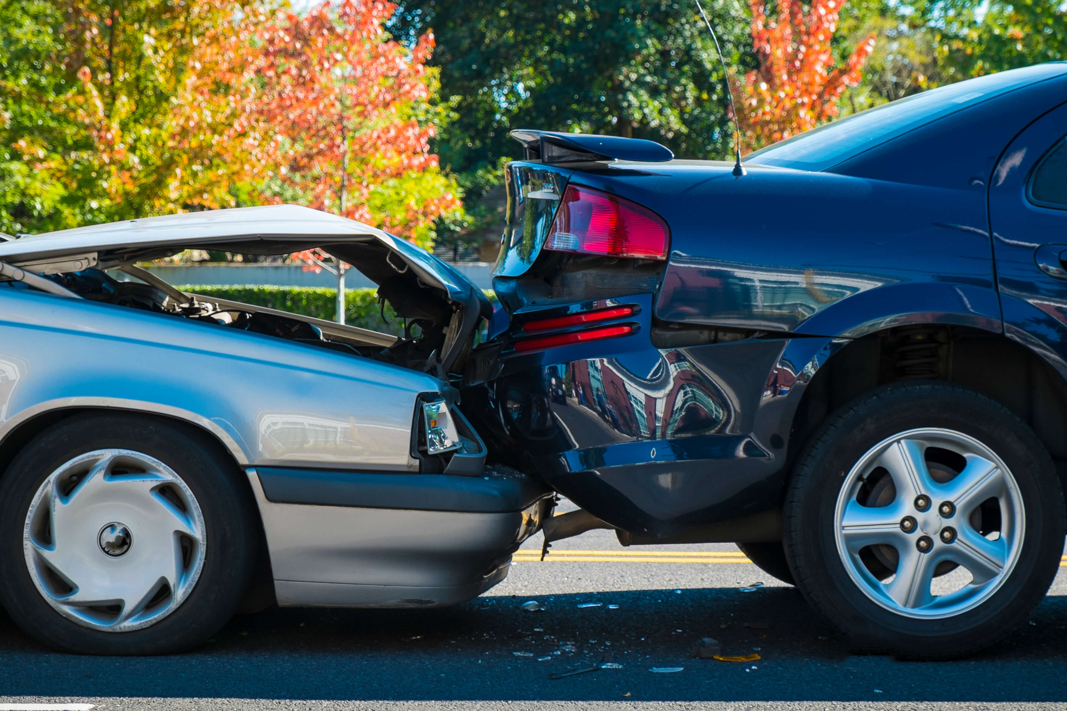 Car accident between two cars on road